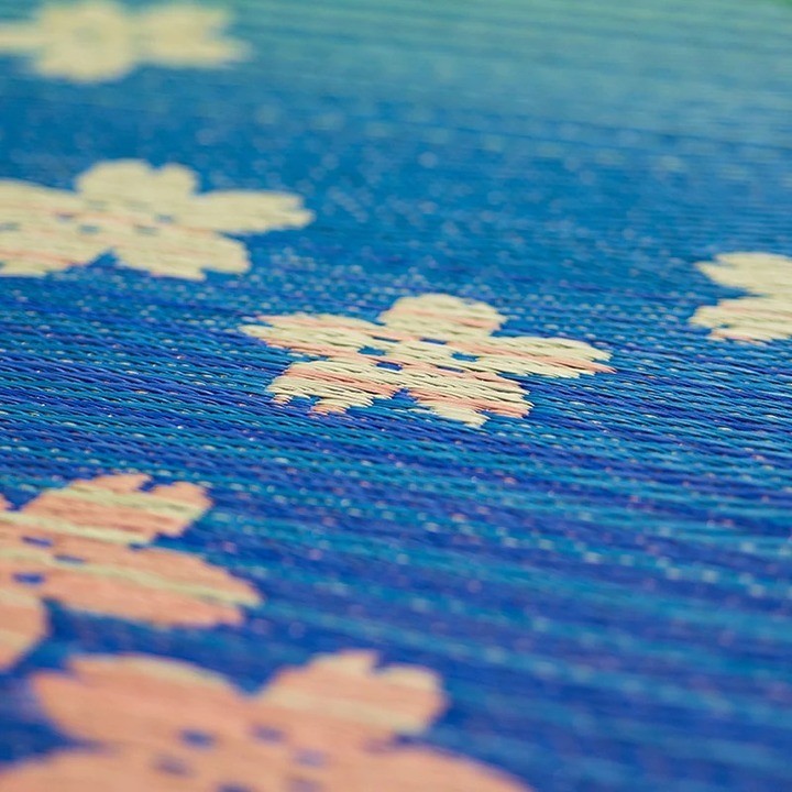Close-up of the woven sakura motif
