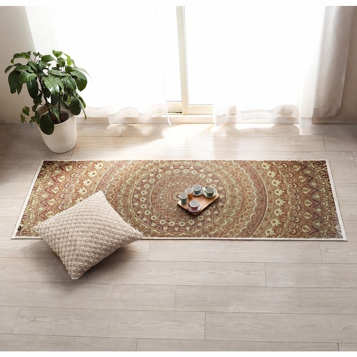 Brown Mandala igusa yoga mat in a room